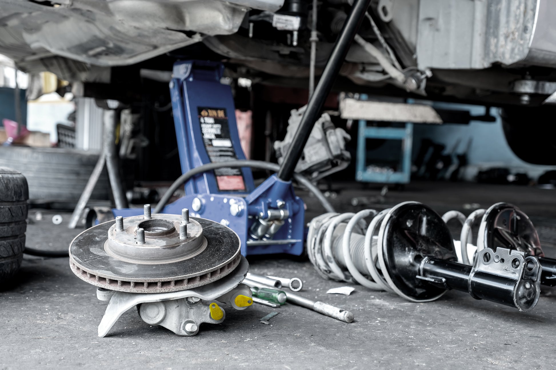 Brake caliper with Yelloc service plugs preventing fluid drips.