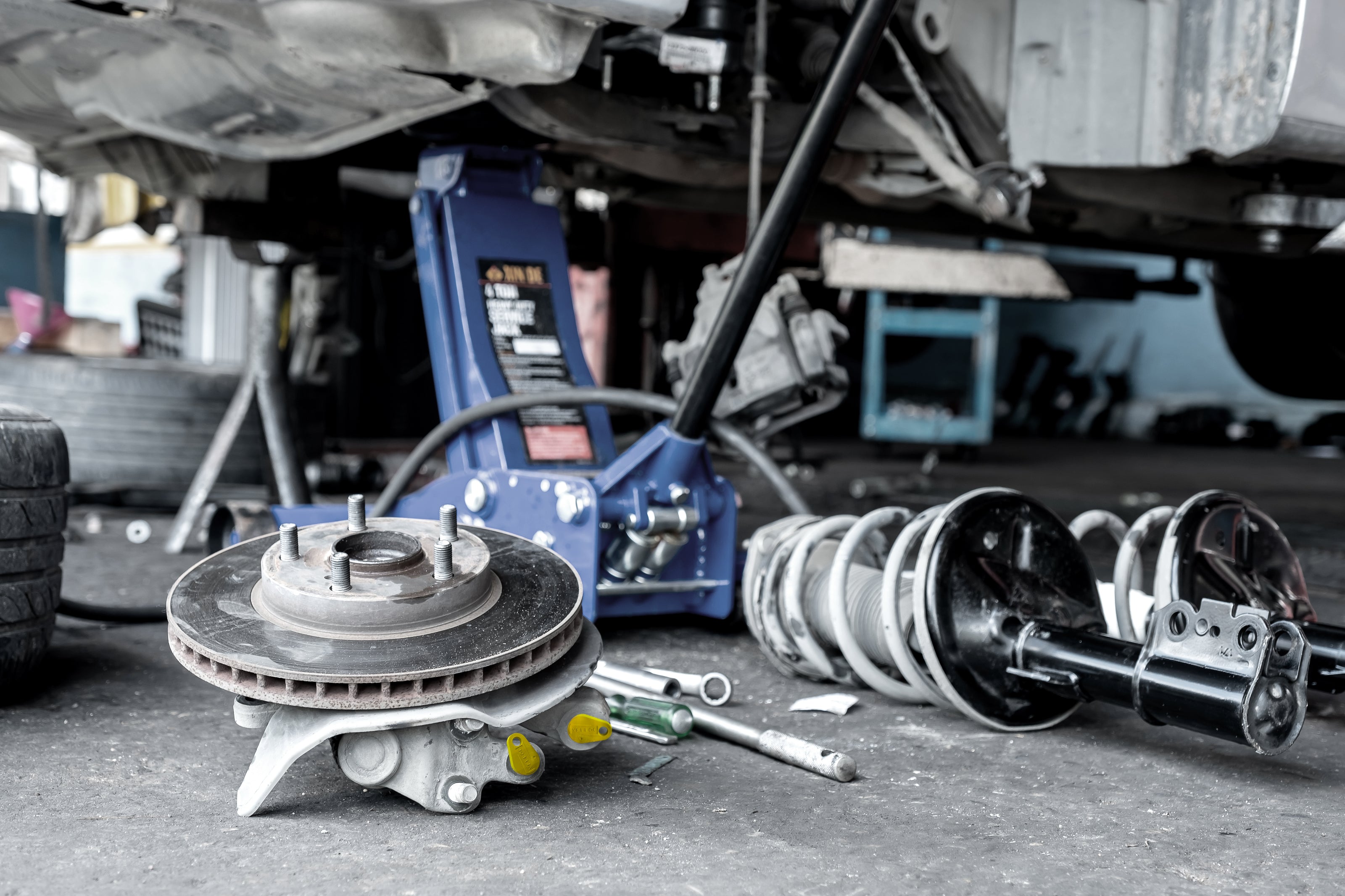 Brake caliper with Yelloc service plugs preventing fluid drips.