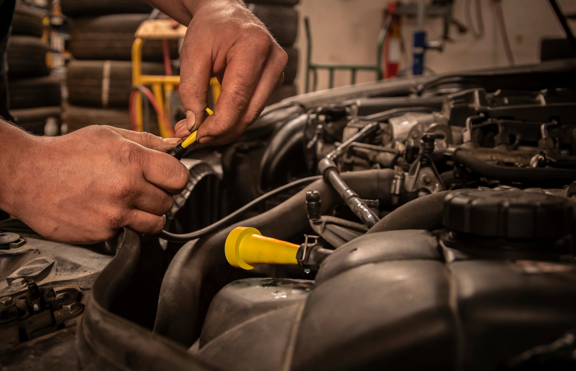 Automotive engine repair: Yelloc plugs preventing fluid leaks in engine hoses.
